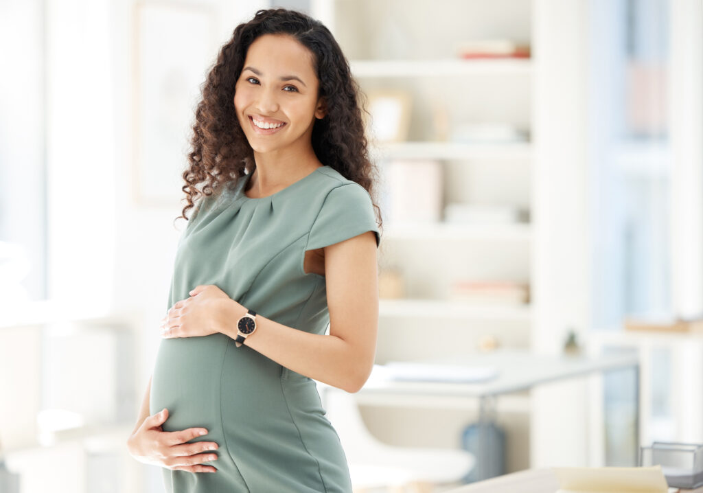 Portrait of a pregnant businesswoman standing in an office