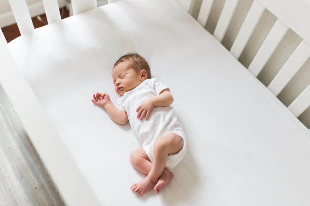 What Many Families Wish They Had Planned Earlier Newborn sleeping peacefully in a crib during a daytime nap